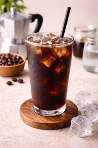 refreshing iced americano coffee with ice cubes in glass